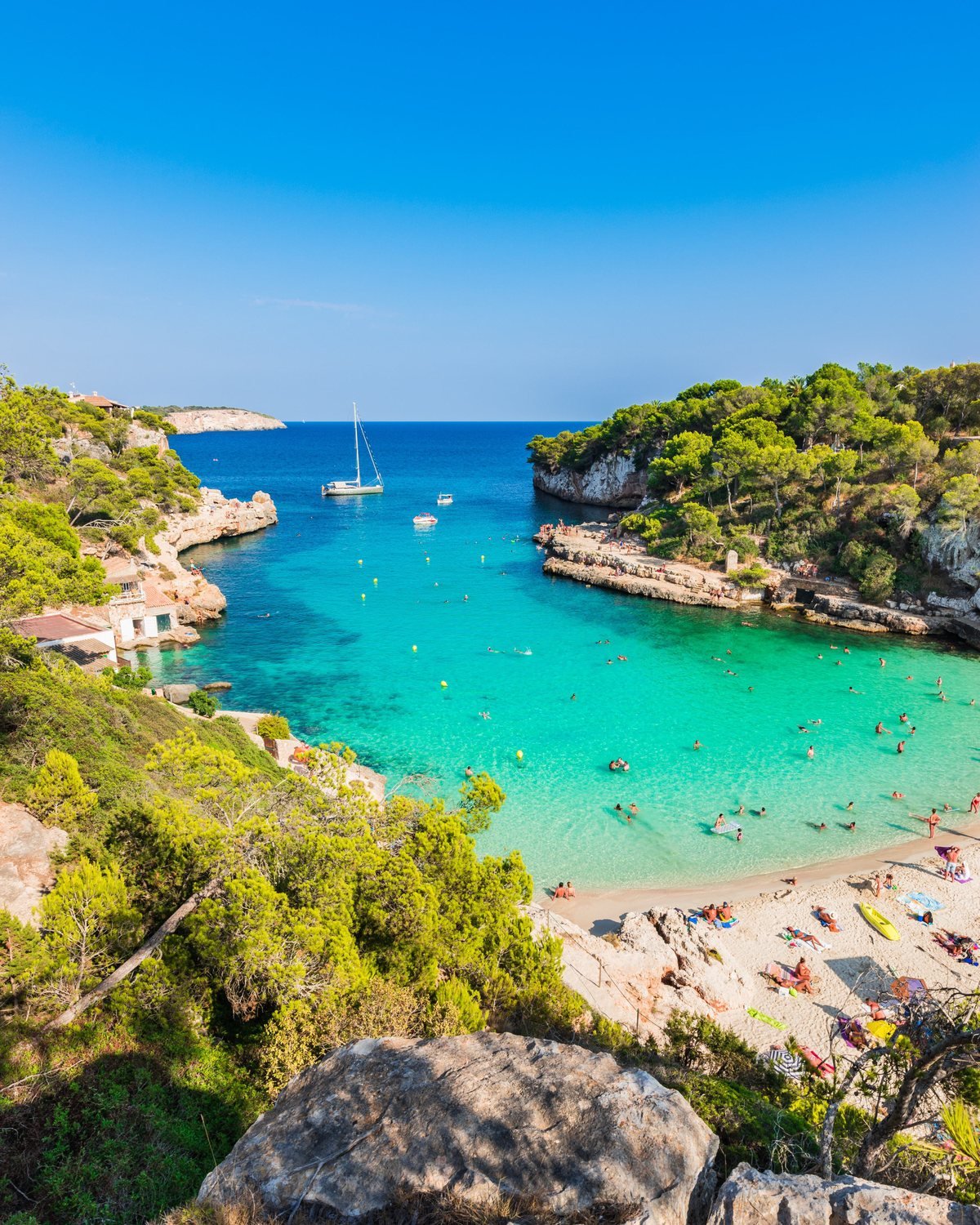 Turquoise water and boats in Cala Llombards, Mallorca
