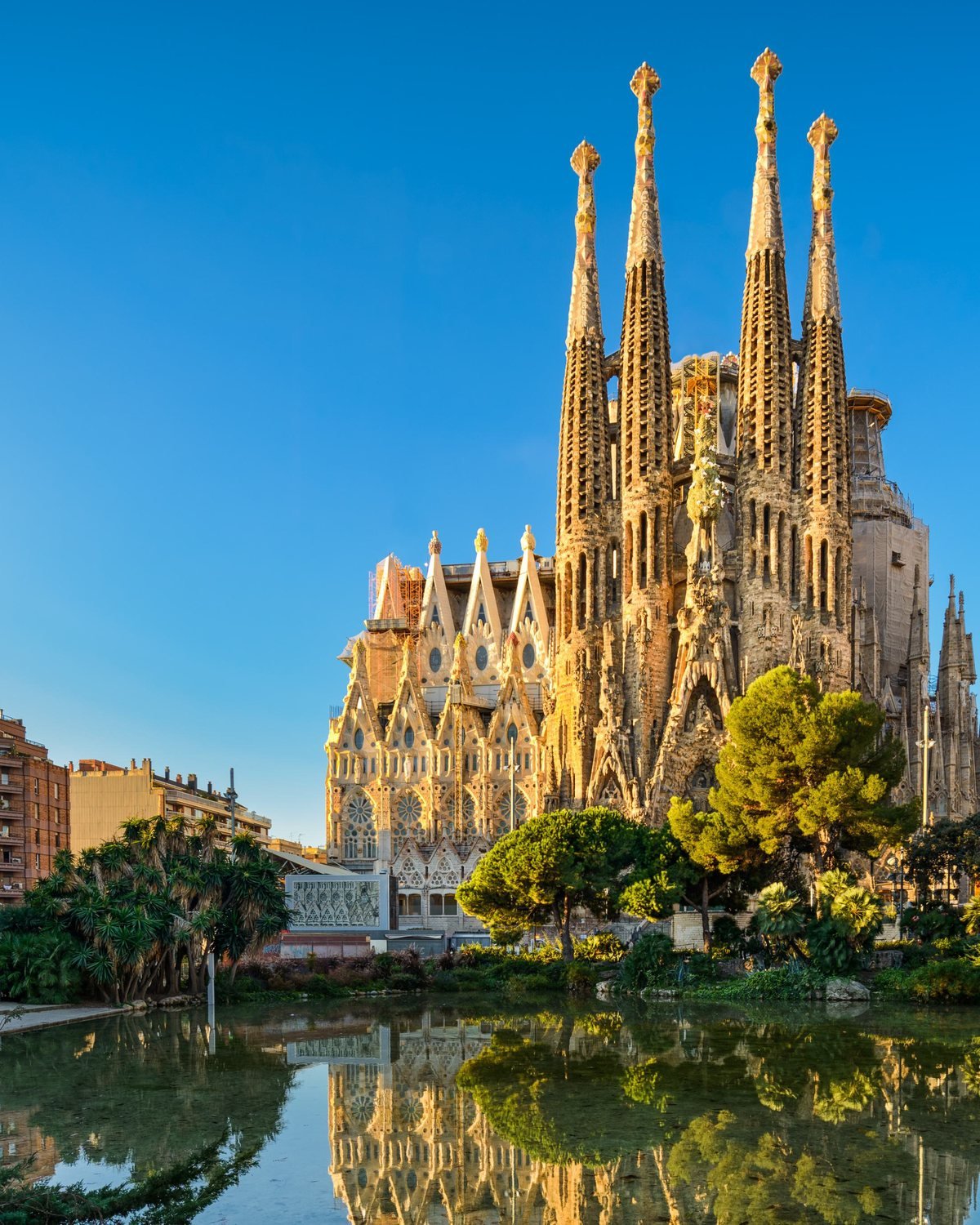La Sagrada Família reflected in the pond at Plaça de Gaudí, Barcelona